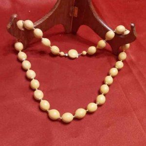 VINTAGE PLASTIC LARGE OVAL BEADS WITH GOLD TONE METAL CAPS WITH ROUND CLASP